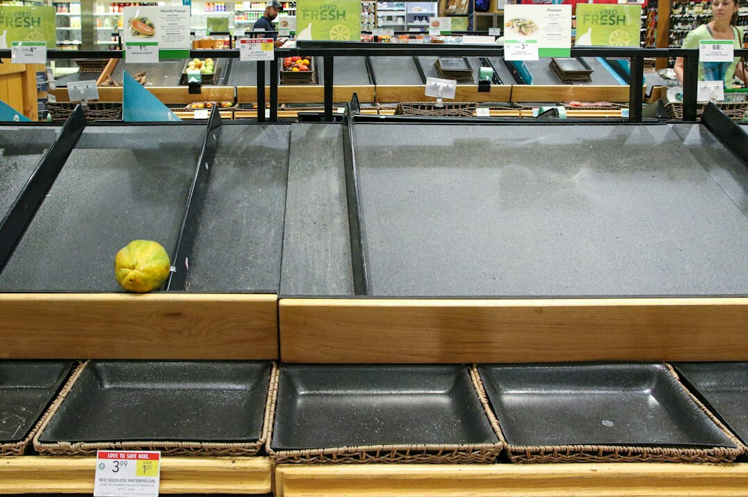 store detective investigating empty shelf